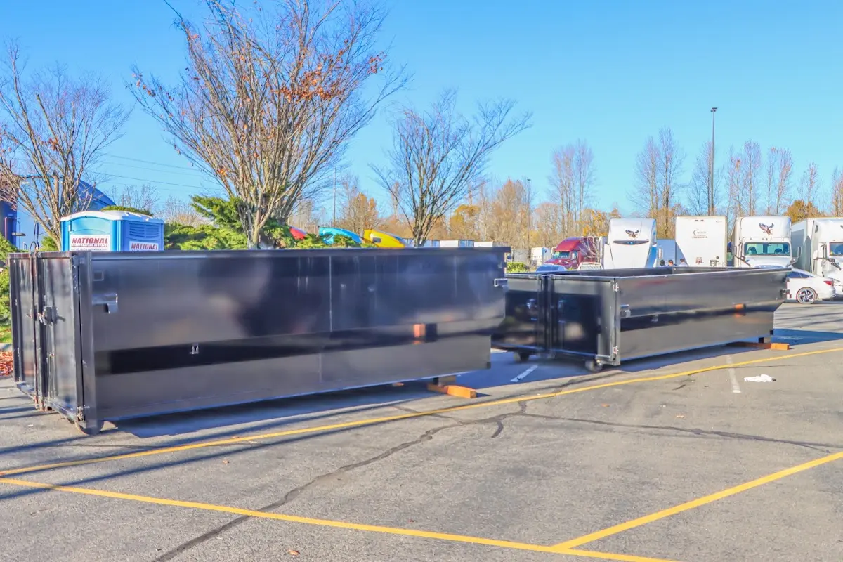 Professional dumpster rental service with roll-off container on residential driveway in La CaÃ±ada Flintridge